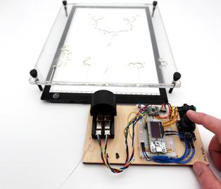Benchtop guidewire navigation setup with a backlit planar vascular phantom